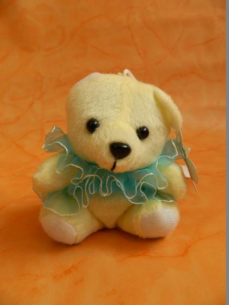 Stoffbär hellgelb mit blau